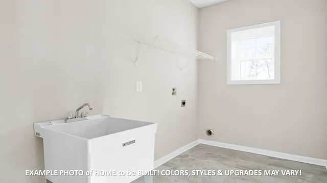 a view of an empty room with a chandelier fan
