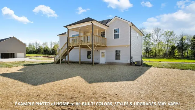 a view of an house with backyard and trees