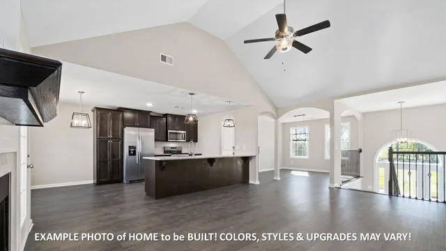 a view of a kitchen with a sink and stainless steel appliances