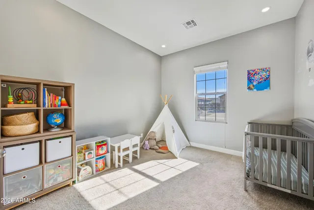 a bedroom with furniture staircase and a window