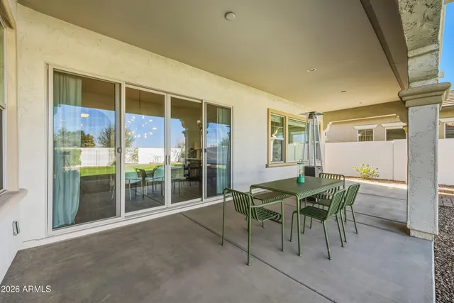 a view of a dining room with furniture and front door