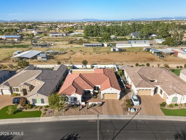 an aerial view of residential building and parking space