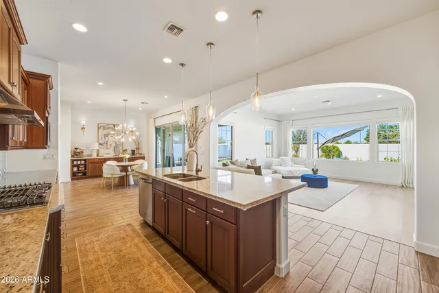 a large white kitchen with a large window