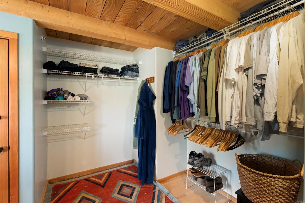 25770 East Grade Road Santa Ysabel, CA 92070 - Photo 26 of 75 a view of walk in closet with clothes and shoes