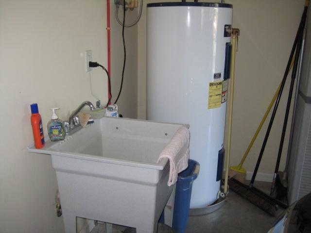 584 Old Shannon Road Lebanon, TN 37090 - Photo 18 of 20 Garage sink and 80-gallon water heater w/circulating hot water.