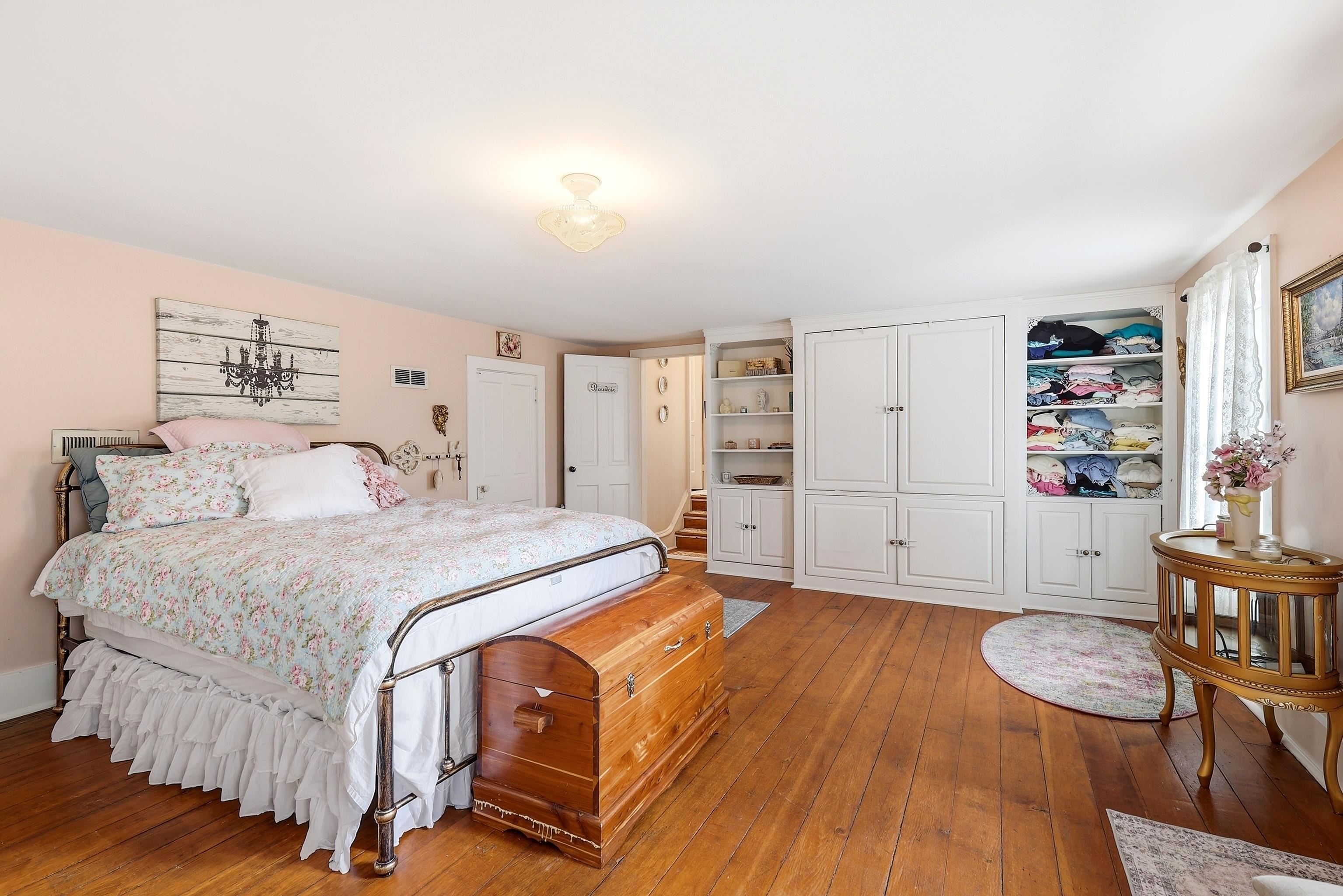 2562 West Blackjack Road Galena, IL 61036 - Photo 37 of 75 a spacious bedroom with a bed and a table in it