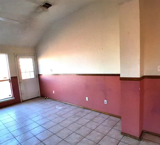 a view of an empty room and window