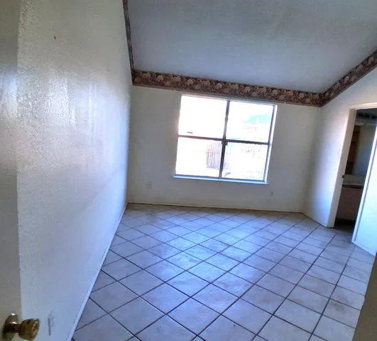 a view of an empty room and window