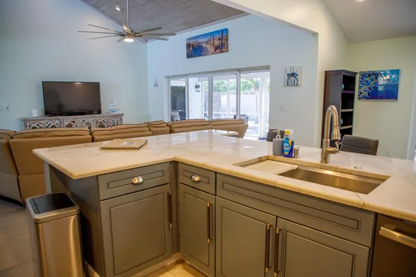 a utility room with sink dryer and washer