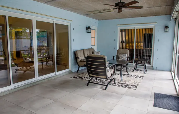 a view of a livingroom with furniture and front door