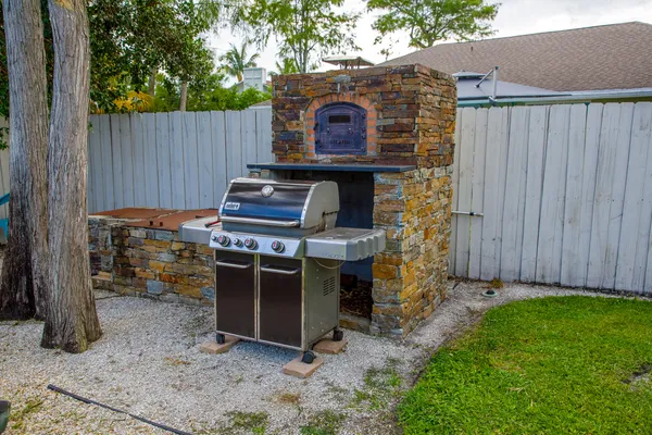 a view of a chairs in backyard of the house