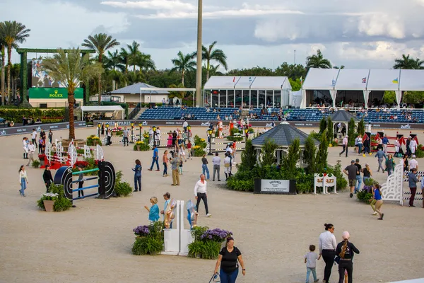 an outdoor space with lots of tables and chairs