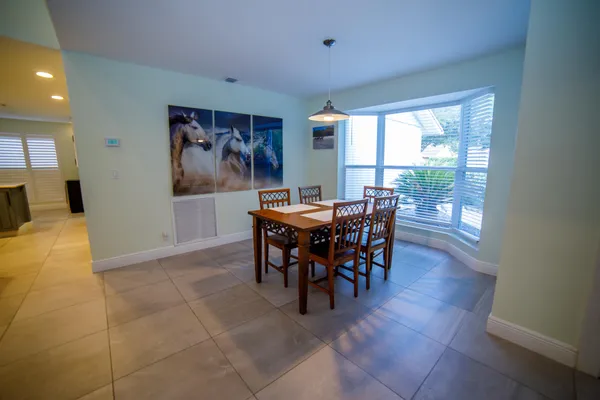 a view of a dining room with furniture window and outside view
