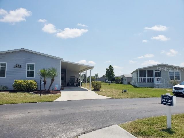 a front view of a house with garden and porch