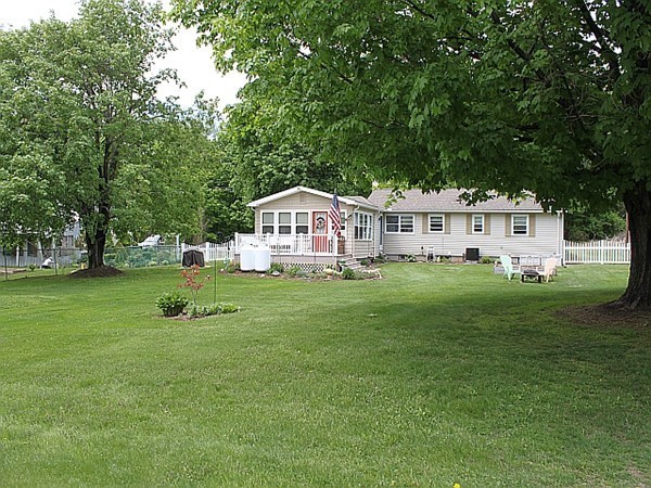 167 Brickyard Road Southampton, MA 01073 - Photo 4 of 27 a house view with a sitting space and garden