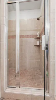 a view of living room kitchen and entryway