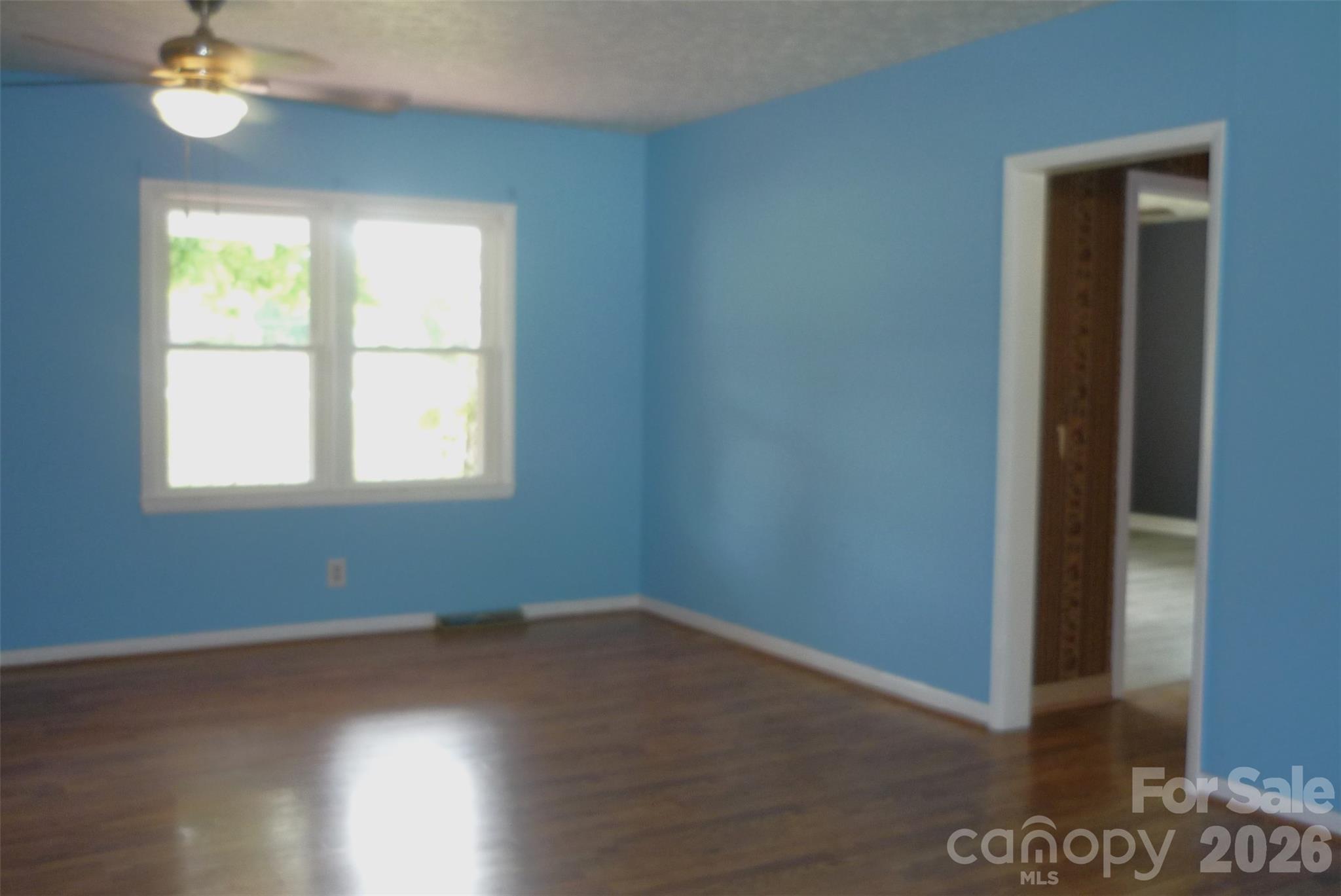 120 Bradley Road Shelby, NC 28152 - Photo 18 of 42 an empty room with wooden floor and windows
