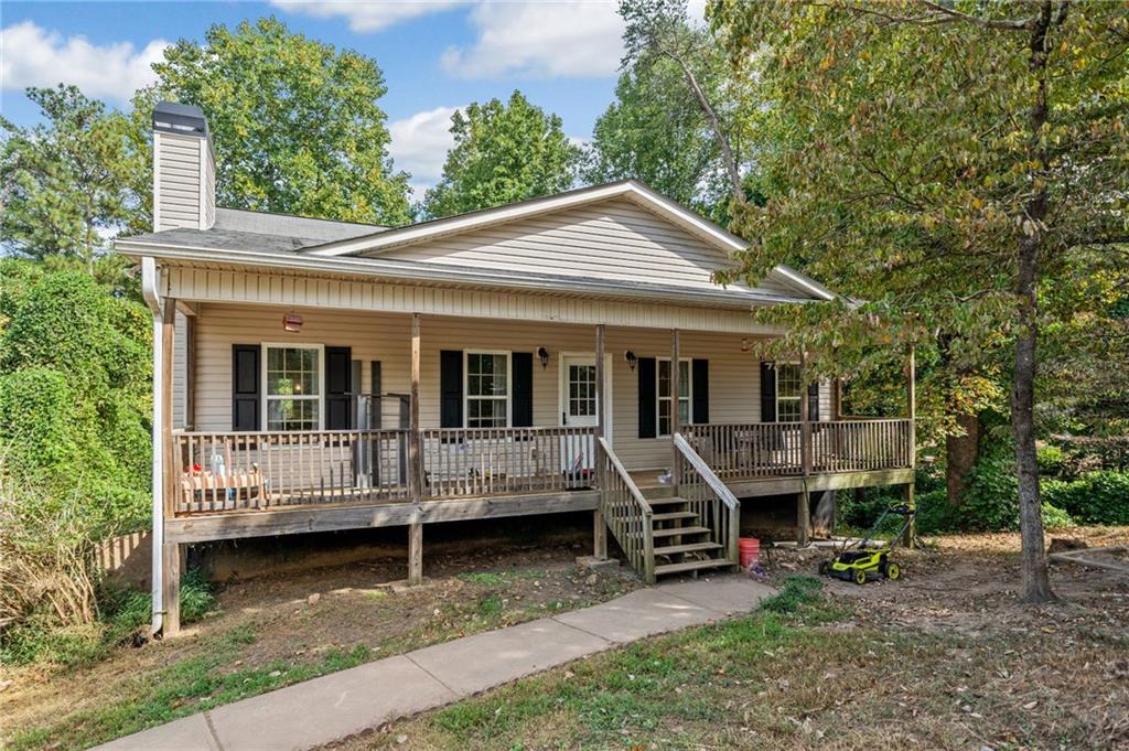 724 Black Knob Church Road Ranger, GA 30734 - Photo 1 of 1 a view of a house with a yard porch and sitting area