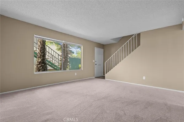 a view of an empty room with windows