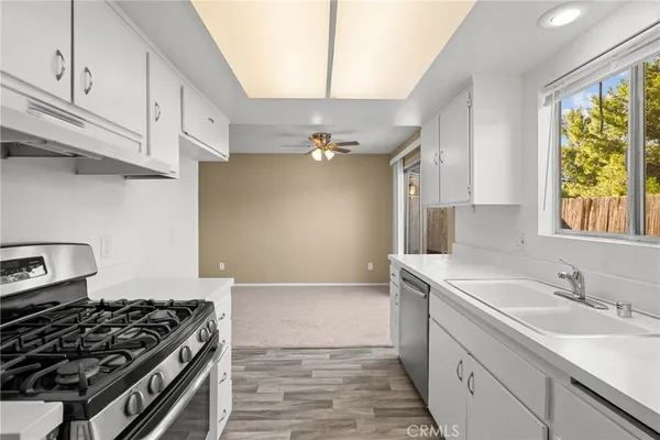 a kitchen with a stove and a sink