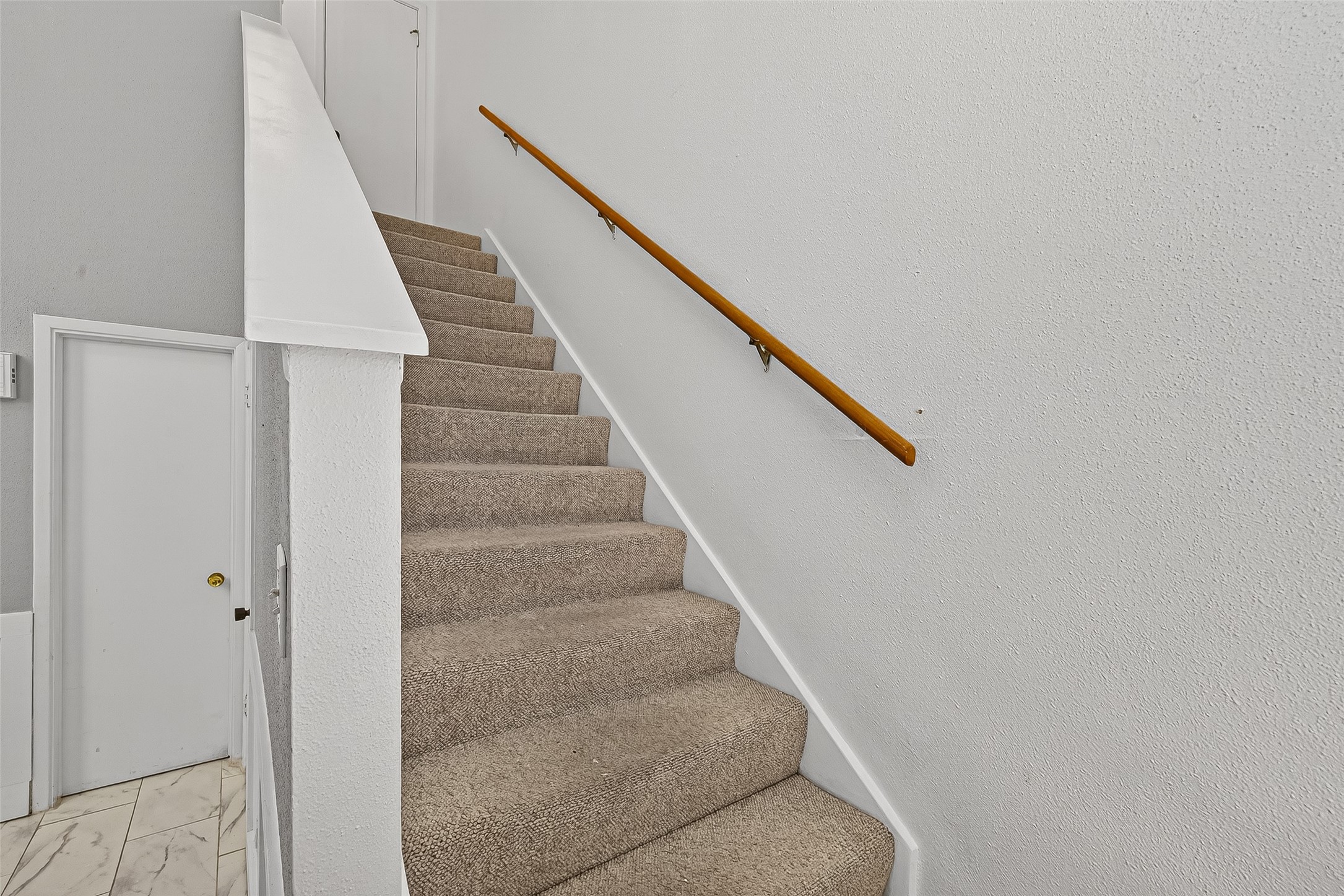 3200 South Gessner Road, Unit 224 Houston, TX 77063 - Photo 14 of 27 Stairs lead to two full bedrooms and 2 bathrooms.