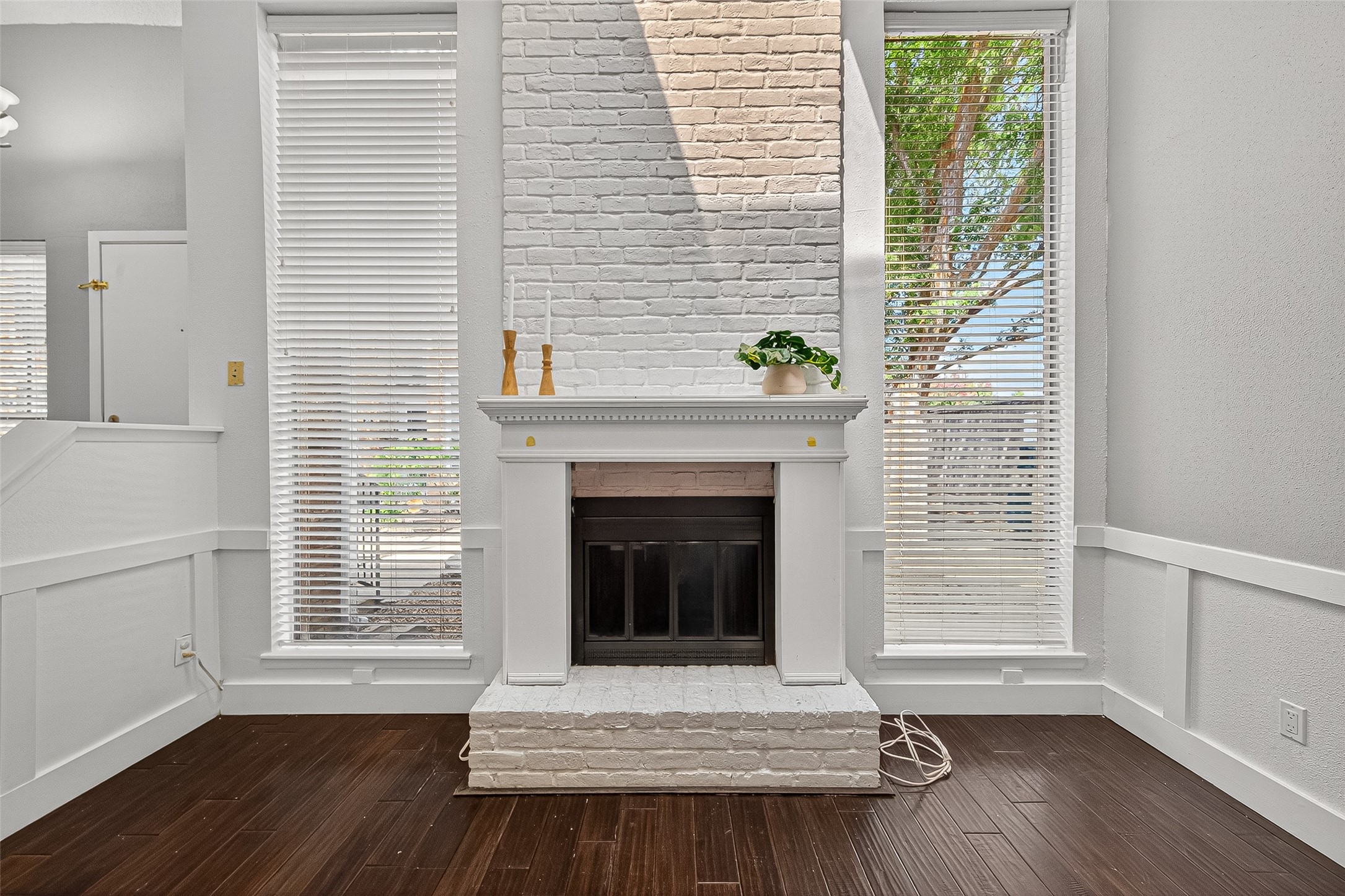 3200 South Gessner Road, Unit 224 Houston, TX 77063 - Photo 6 of 27 The striking two-story brick fireplace serves as the heart of the home.