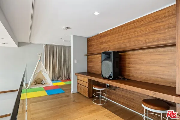 a room with wooden floor and furniture