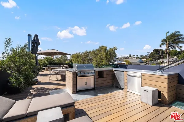 a view of a terrace with furniture