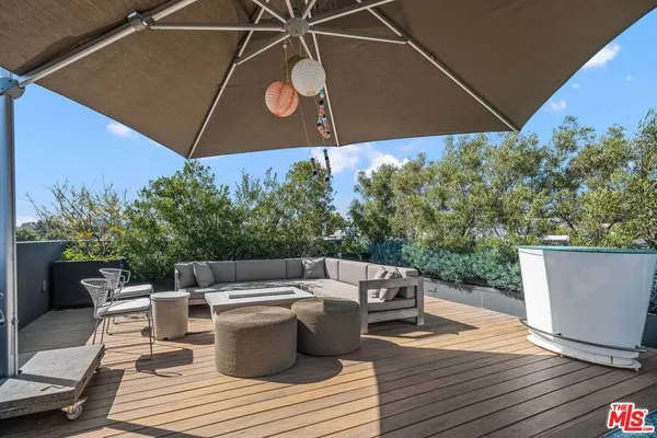 a view of a roof deck with couches