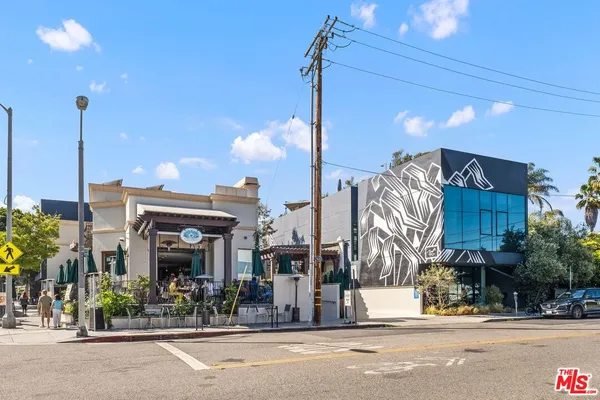 a view of a building with a street