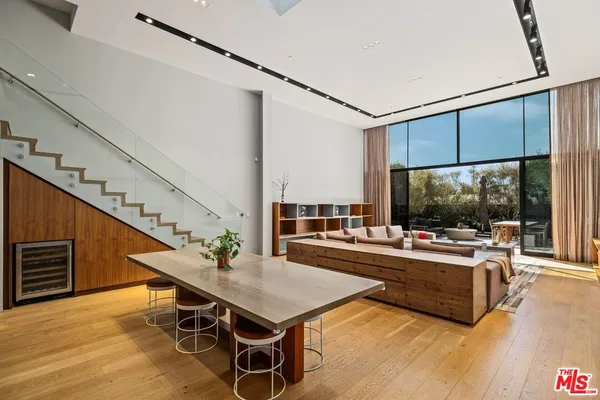 a living room with furniture fireplace and flat screen tv
