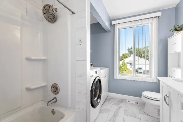 a bathroom with a sink a toilet and a bathtub