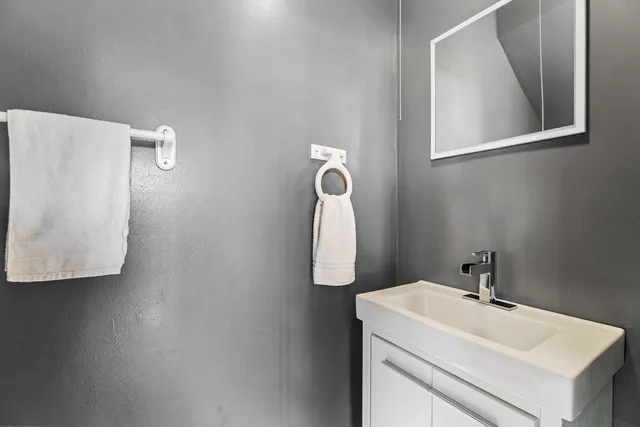 a bathroom with a sink and mirror