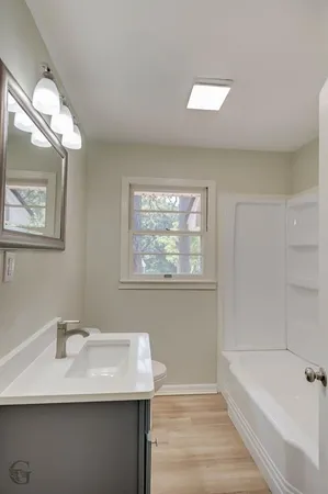 a bathroom with a sink and a bathtub