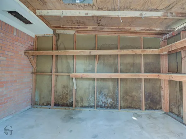 a view of outdoor space with wooden shelves