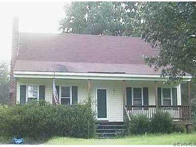 front view of a house with a garden