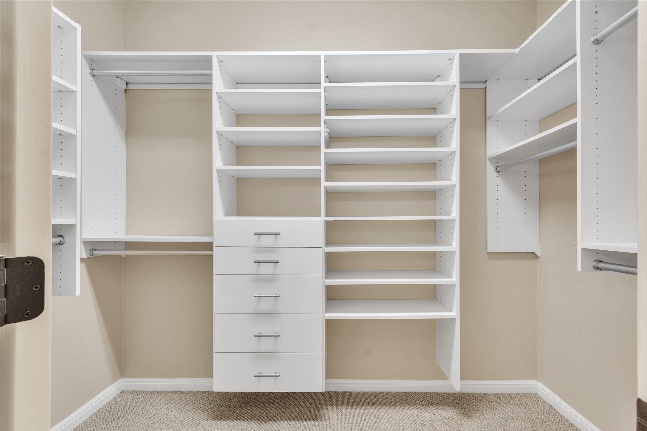 409 Rio Grande Loop Georgetown, TX 78633 - Photo 18 of 26 Primary Customizable closet shelving and drawers provide ample storage solutions in this well-appointed space.