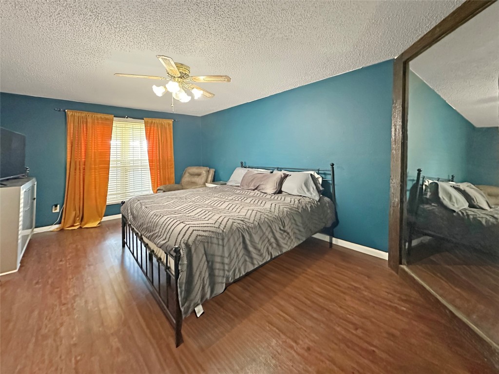 16230 Katherine Lane Channelview, TX 77530 - Photo 13 of 19 a bedroom with a bed and window