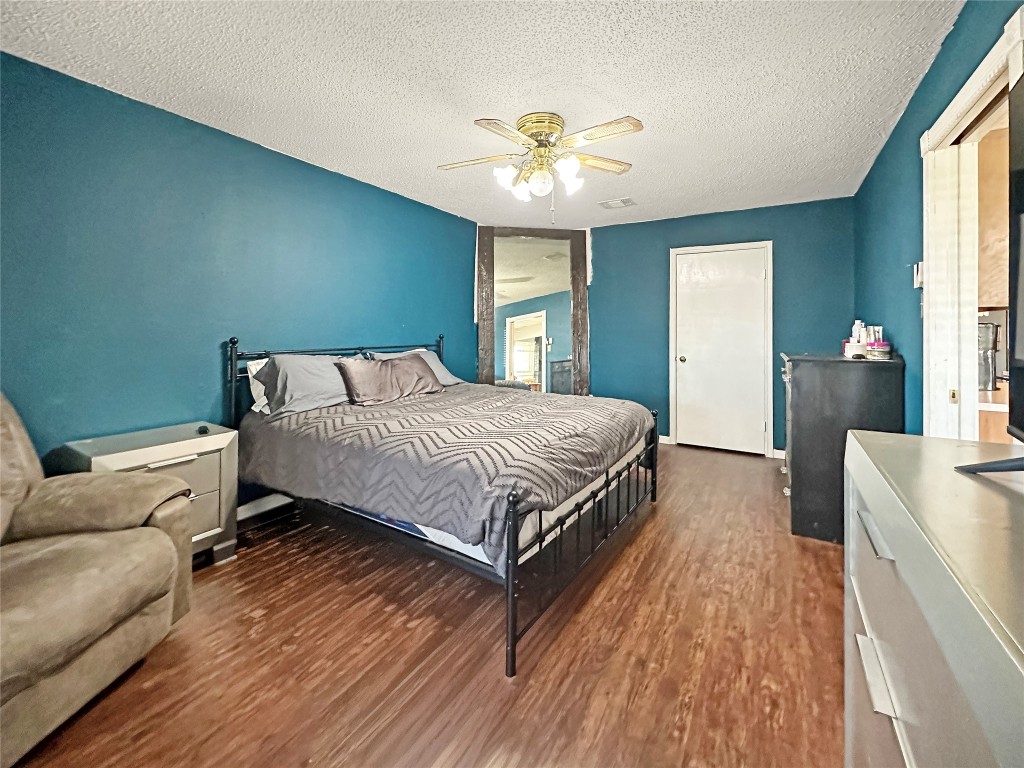 16230 Katherine Lane Channelview, TX 77530 - Photo 14 of 19 a bedroom with a bed and window