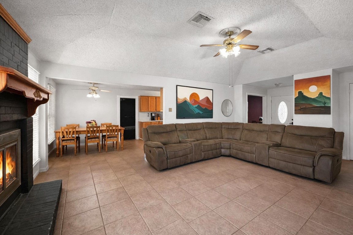 16230 Katherine Lane Channelview, TX 77530 - Photo 5 of 19 a living room with furniture and a flat screen tv