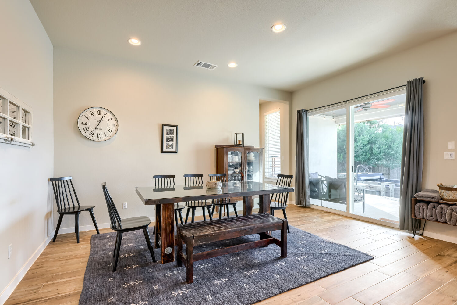 621 Rancho Sienna Loop Georgetown, TX 78628 - Photo 12 of 28 A well-lit dining area offers a seamless connection to the outdoor patio through sliding glass doors.