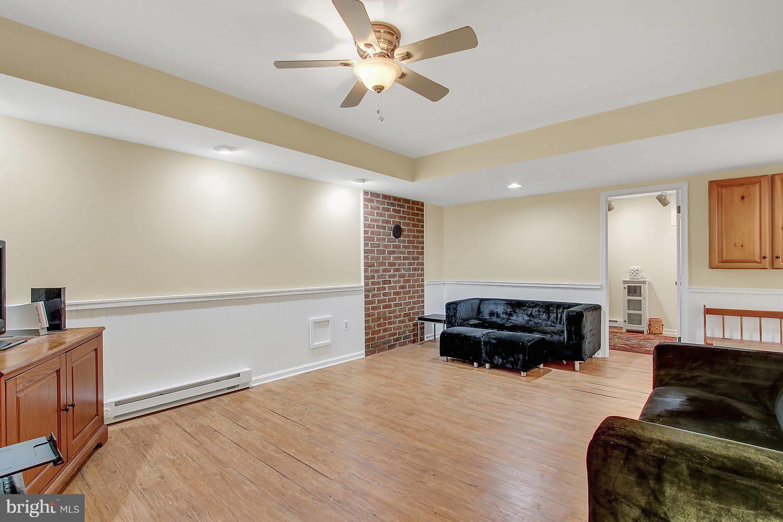 5325 Sweet Air Road Baldwin, MD 21013 - Photo 25 of 30 Lower Level Rec Room, Flue for Woodstove