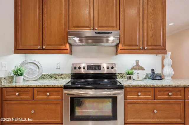 a bathroom with a sink vanity granite and a mirror