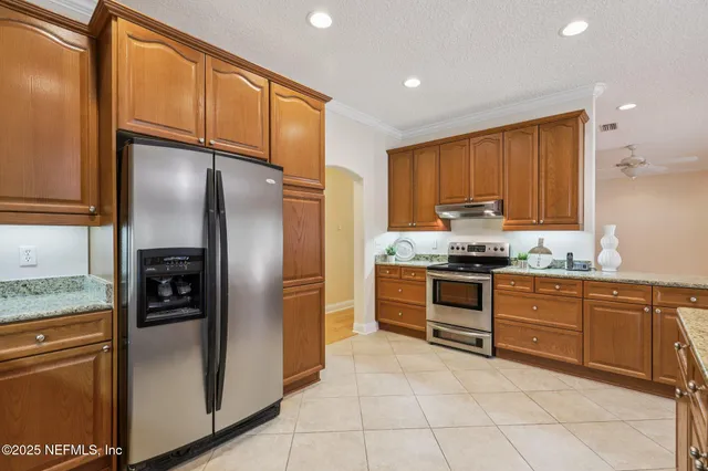 a view of a room with stairs and white walls