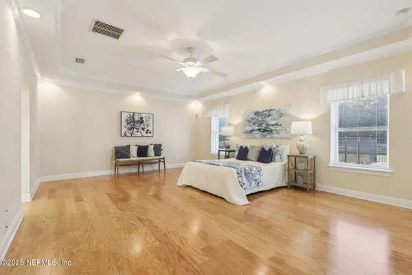 an aerial view of residential houses and trees in the background