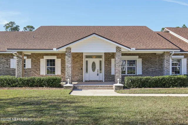 a view of kitchen with furniture and refrigerator
