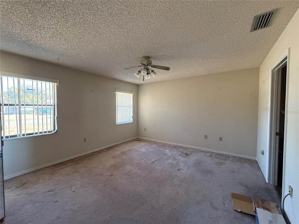 34847 Learn Road Leesburg, FL 34788 - Photo 13 of 25 an empty room with a window