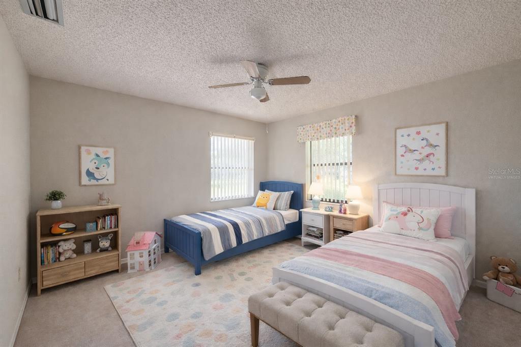 34847 Learn Road Leesburg, FL 34788 - Photo 16 of 25 a bedroom with two beds and a tv