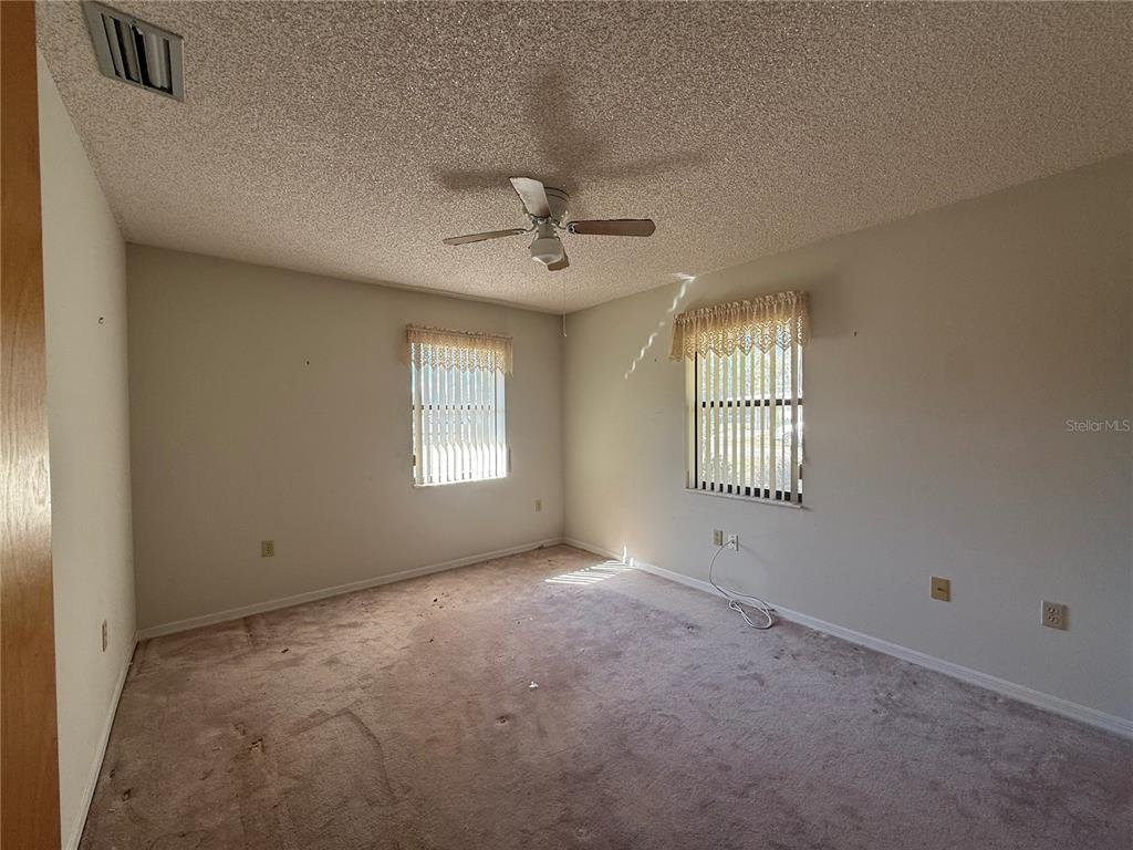 34847 Learn Road Leesburg, FL 34788 - Photo 17 of 25 a view of an empty room with a window