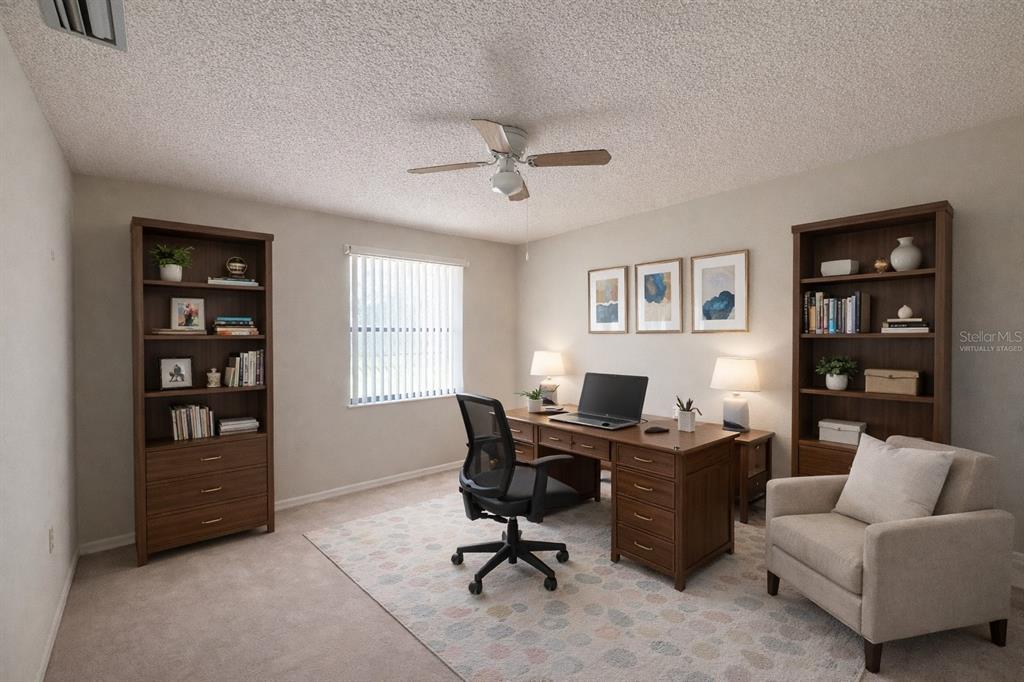 34847 Learn Road Leesburg, FL 34788 - Photo 18 of 25 a view of a livingroom with workspace and a window